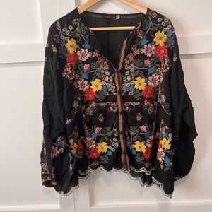 Black and well-embroidered Johnny Was blouse with full button front & v neck.